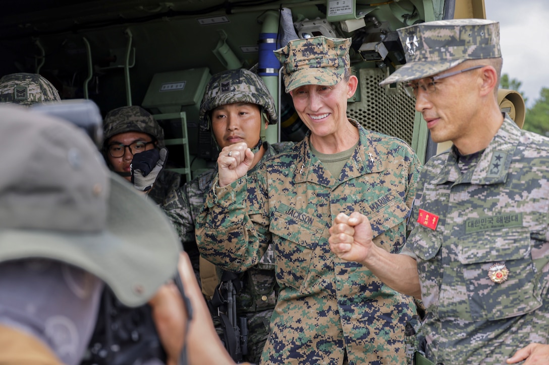 U.S. Marine Corps Maj. Gen. Valerie A. Jackson, commander of U.S. Marine Corps Forces Korea, and ROK Marine Corps Maj. Gen. Lee Ho-Jong, commanding general of 1st Marine Division, ROK Marine Corps, pose for a photo with ROK Marines with 1st Marine Division during Korea Marine Exercise Program 25.2 in Pohang, South Korea on Aug. 6, 2025. KMEP is conducted regularly between the ROK and U.S. Marine Corps to increase their combined capabilities through realistic training geared towards deterrence and maintaining peace in the Indo-Pacific. (U.S. Marine Corps photo by Cpl. Simon Saravia)