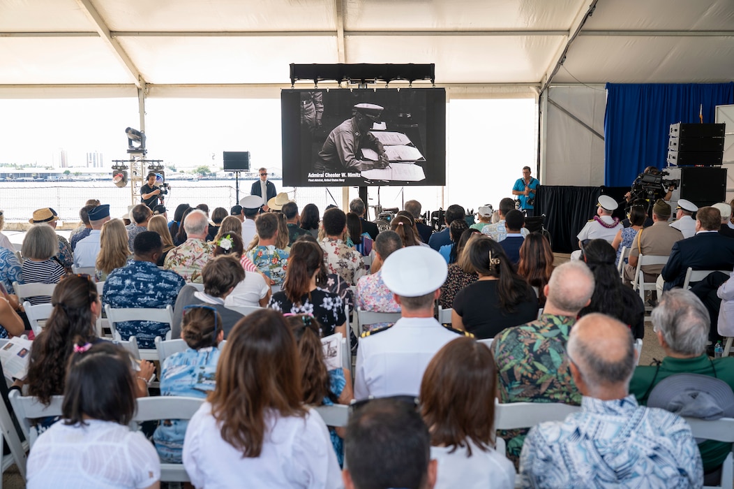 Attendees watch a tribute video during a ceremony commemorating the 80th anniversary of the end of World War II in Pearl Harbor, Hawaii, Sept. 2, 2025.