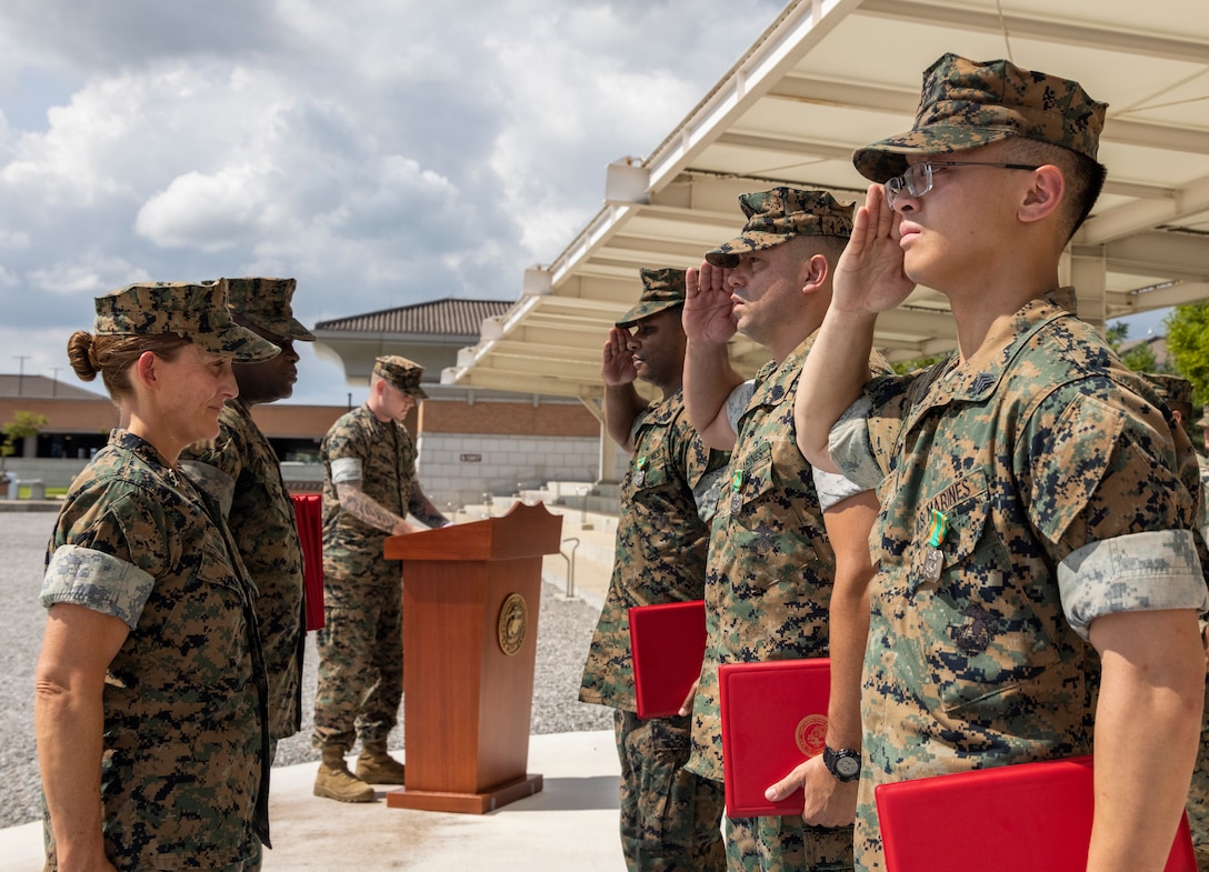 U.S. Marines with U.S. Marine Corps Forces Korea, salute Maj. Gen. Valerie A. Jackson, commander of MARFORK, during their award ceremony on U.S. Army Garrison Humphreys, Republic of Korea, Aug. 29, 2025. The Marines received the awards to recognize the superior performance of their duties during Ulchi Freedom Shield. UFS is an annual joint military exercise conducted by the Republic of Korea and the United States to enhance combined defense posture and response capabilities. (U.S. Marine Corps photo by Cpl. Simon Saravia)