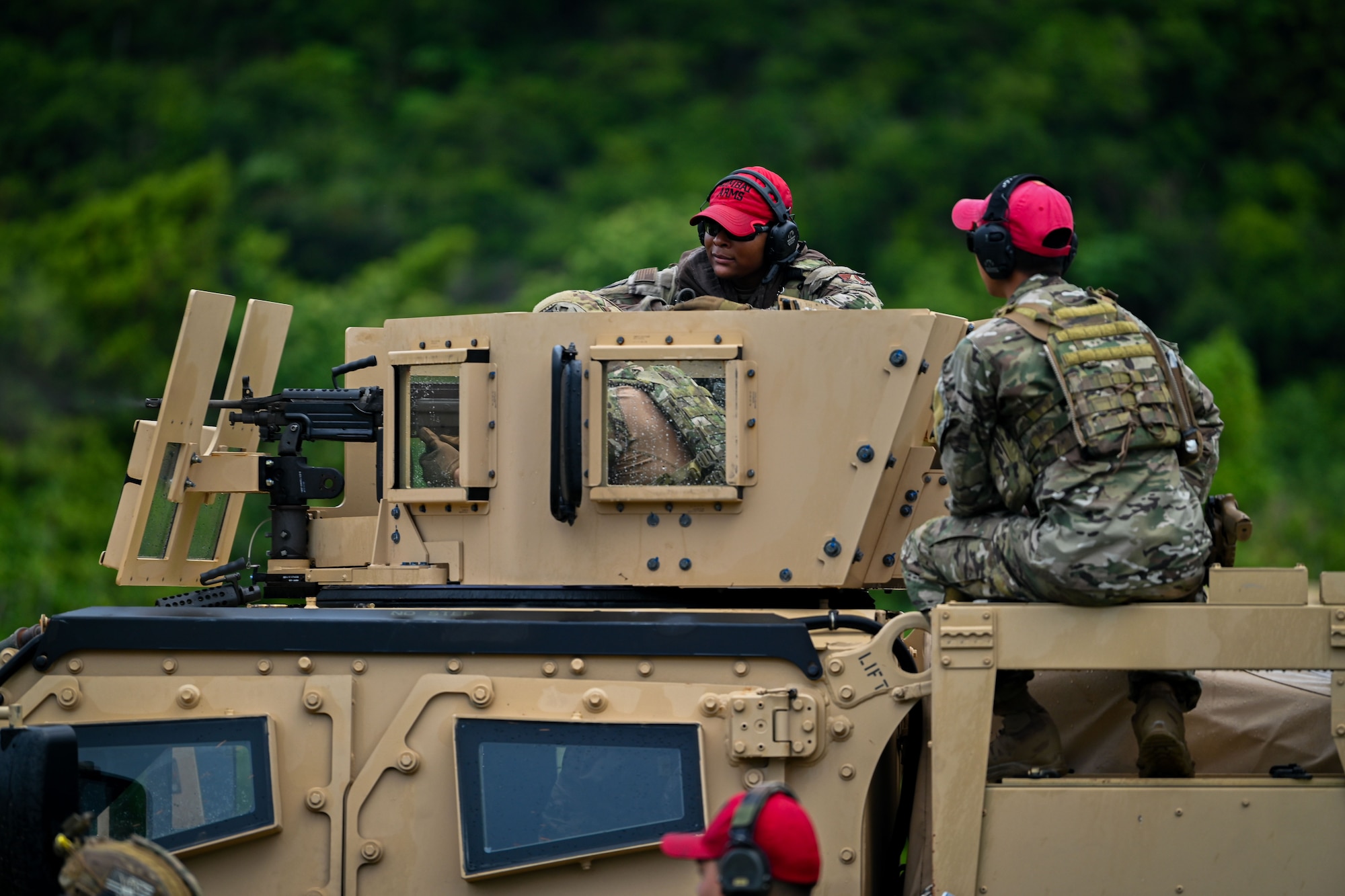 Photo of an Airman coaching another Airman during training