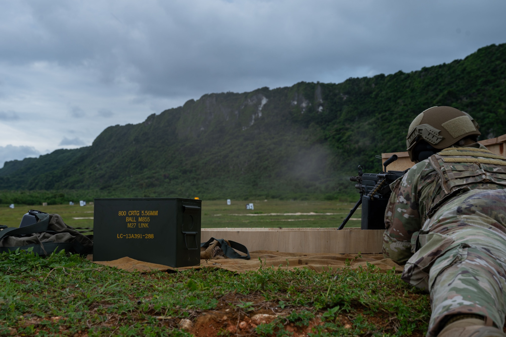 Photo of an Airman firing an M249 Squad Automatic Weapon