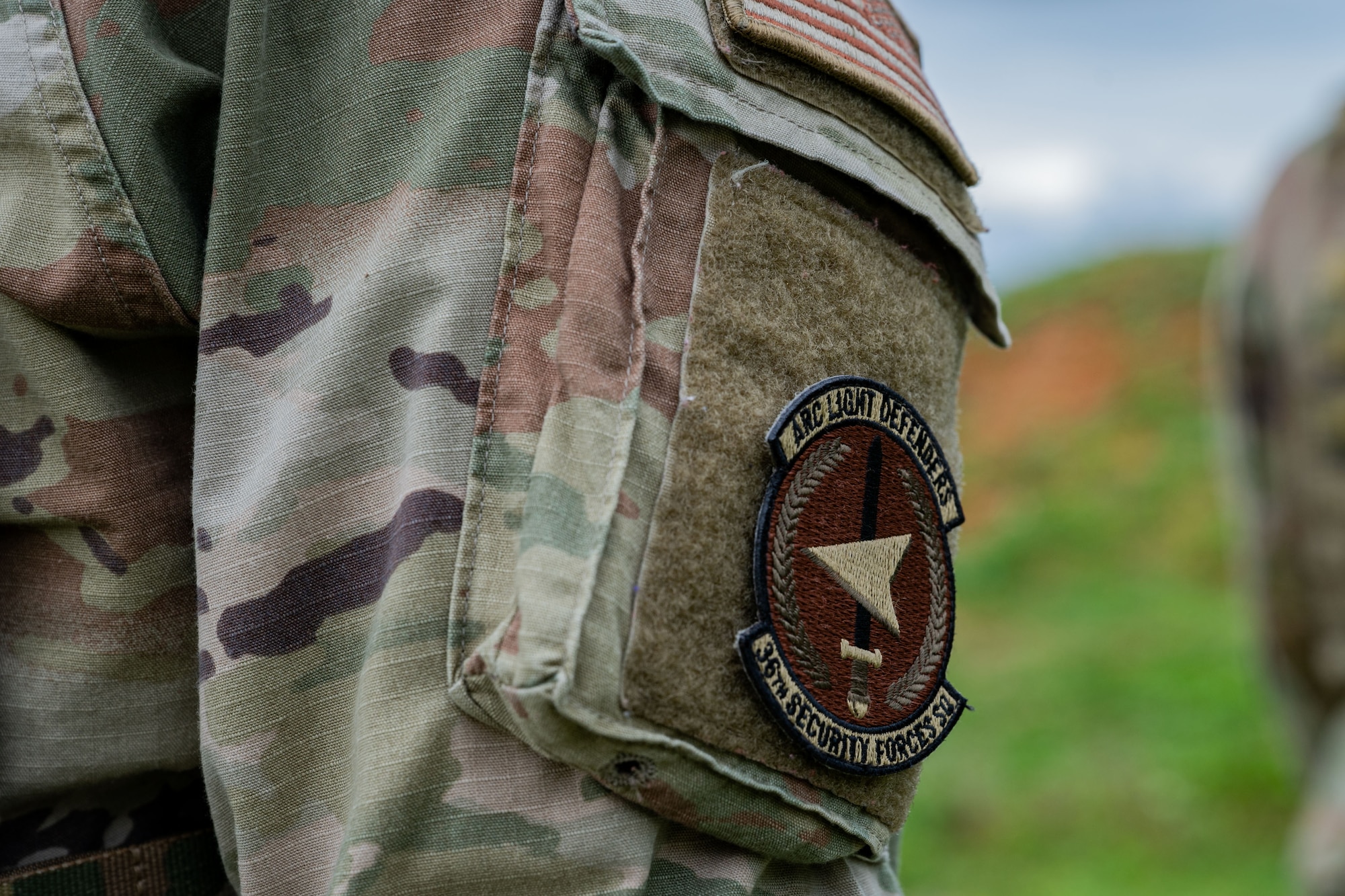 Photo of an Airman wearing an Arc Light Defenders patch