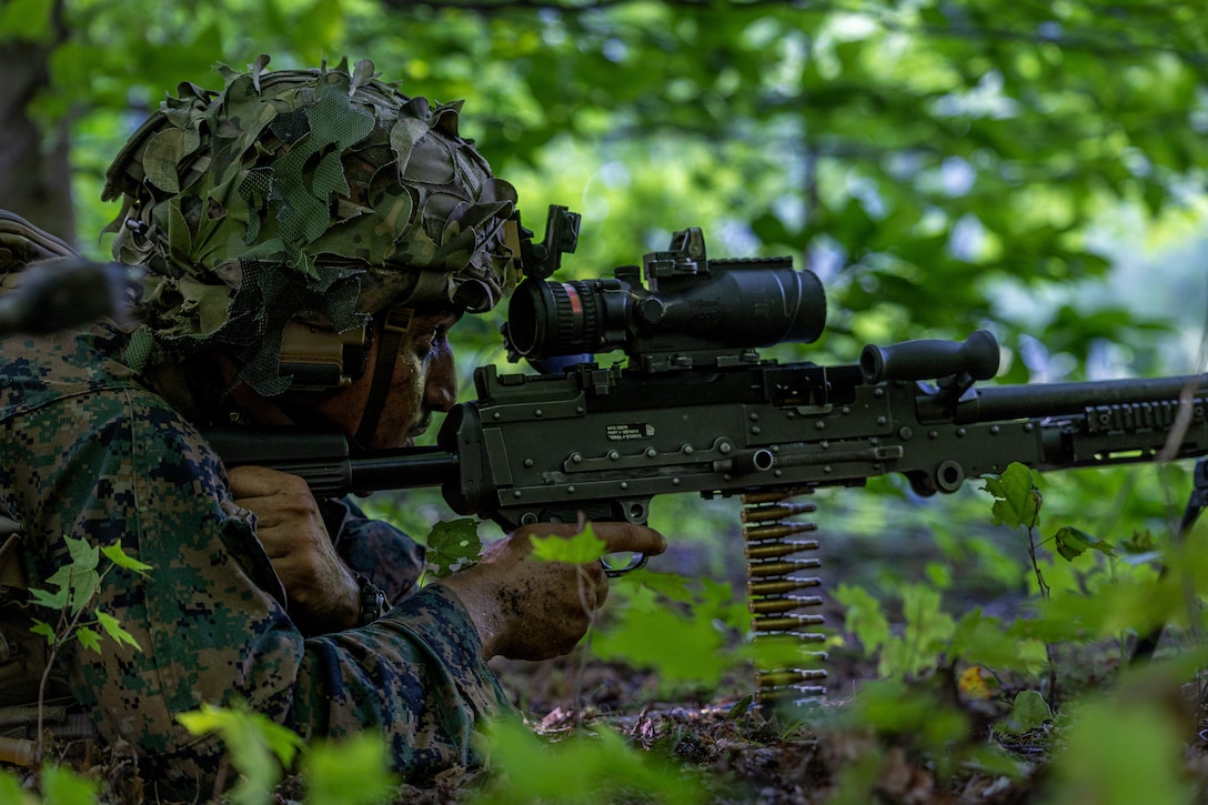 U.S. Marine Corps Lance Cpl. Ahmed Alsawafy, a machine gunner with Charlie Company, 1st Battalion, 24th Marine Regiment, 4th Marine Division, locks in his sight during an offensive raid training event for training exercise Northern Strike 25-2 at Camp Grayling, Michigan, Aug. 9, 2025. Northern Strike, held Aug. 2 to 16, 2025, is designed to validate readiness of Joint Reserve forces at the National All-Domain Warfighting Center. This year's iteration featured approximately 7,500 participants. (U.S. Marine Corps photo by Cpl. Aaron TorresLemus)