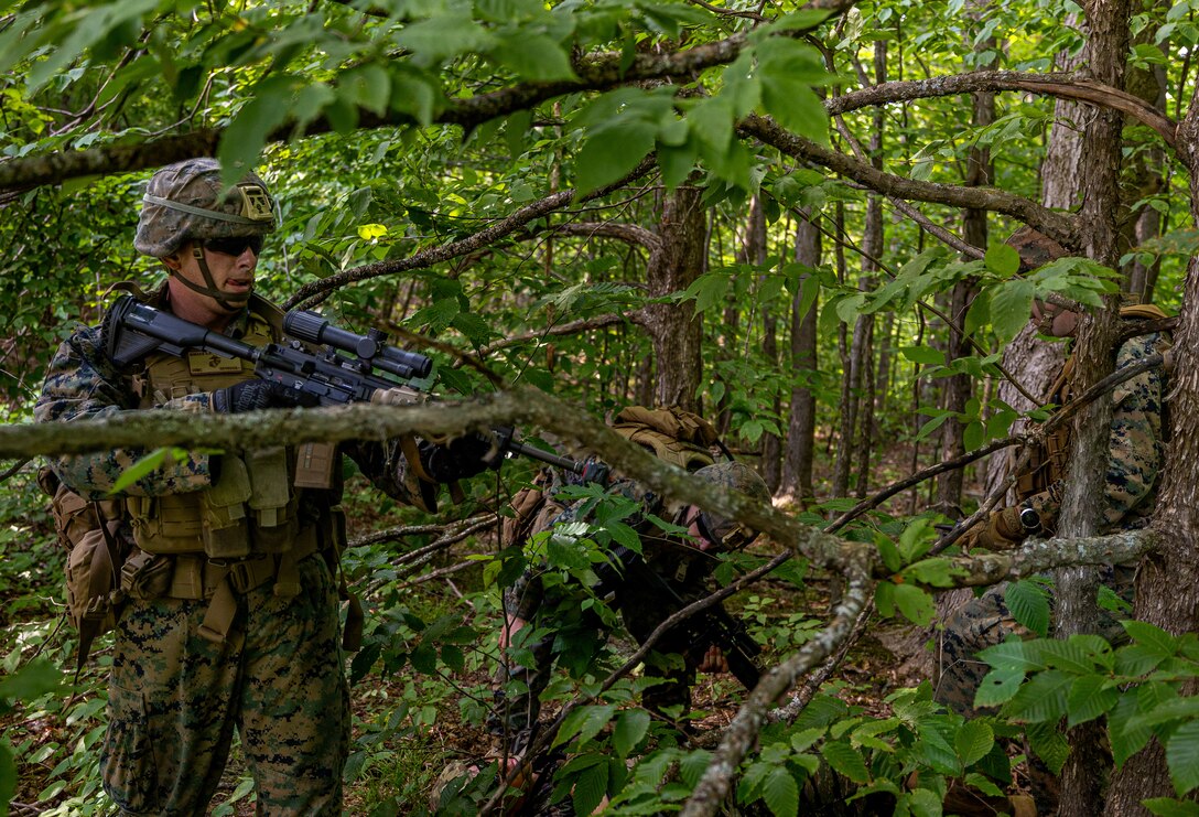 U.S. Marine Corps Lance Cpl. Devyn Sheaks, a rifleman with Charlie Company, 1st Battalion 24th, Marine Regiment, 4th Marine Division, provides additional security to Marines with Charlie Co. 1/24, simulating assessment on a controlled casualty during an offensive raid training event for training exercise Northern Strike 25-2 at Camp Grayling, Michigan, Aug. 9, 2025. Northern Strike, held Aug. 2 to 16, 2025, is designed to validate readiness of Joint Reserve forces at the National All-Domain Warfighting Center. This year's iteration featured approximately 7,500 participants. (U.S. Marine Corps photo by Cpl. Aaron TorresLemus)