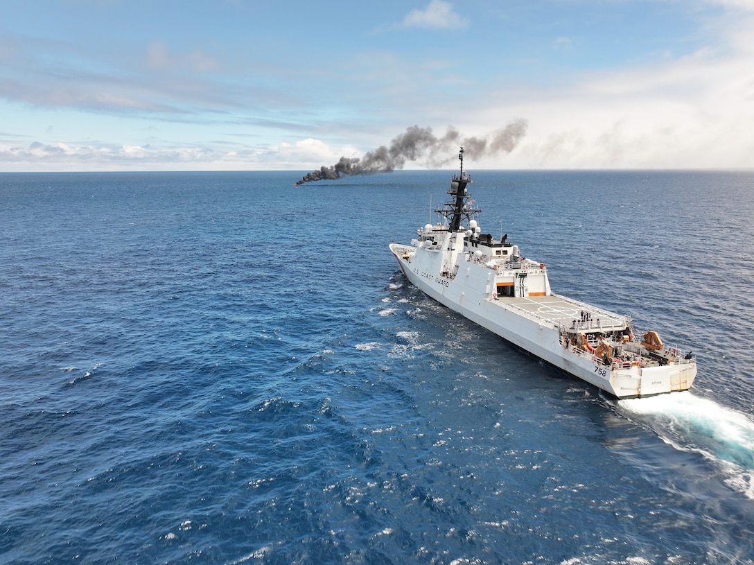 The crew of USCGC Stone (WMSL 758) keeps watch over a burning vessel that was interdicted in the Eastern Pacific Ocean, Aug. 16, 2025. Through Operation Pacific Viper, the Coast Guard is accelerating counter-drug operations in the Eastern Pacific Ocean, where significant transport of illicit narcotics continues from South America. (U.S. Coast Guard photo)