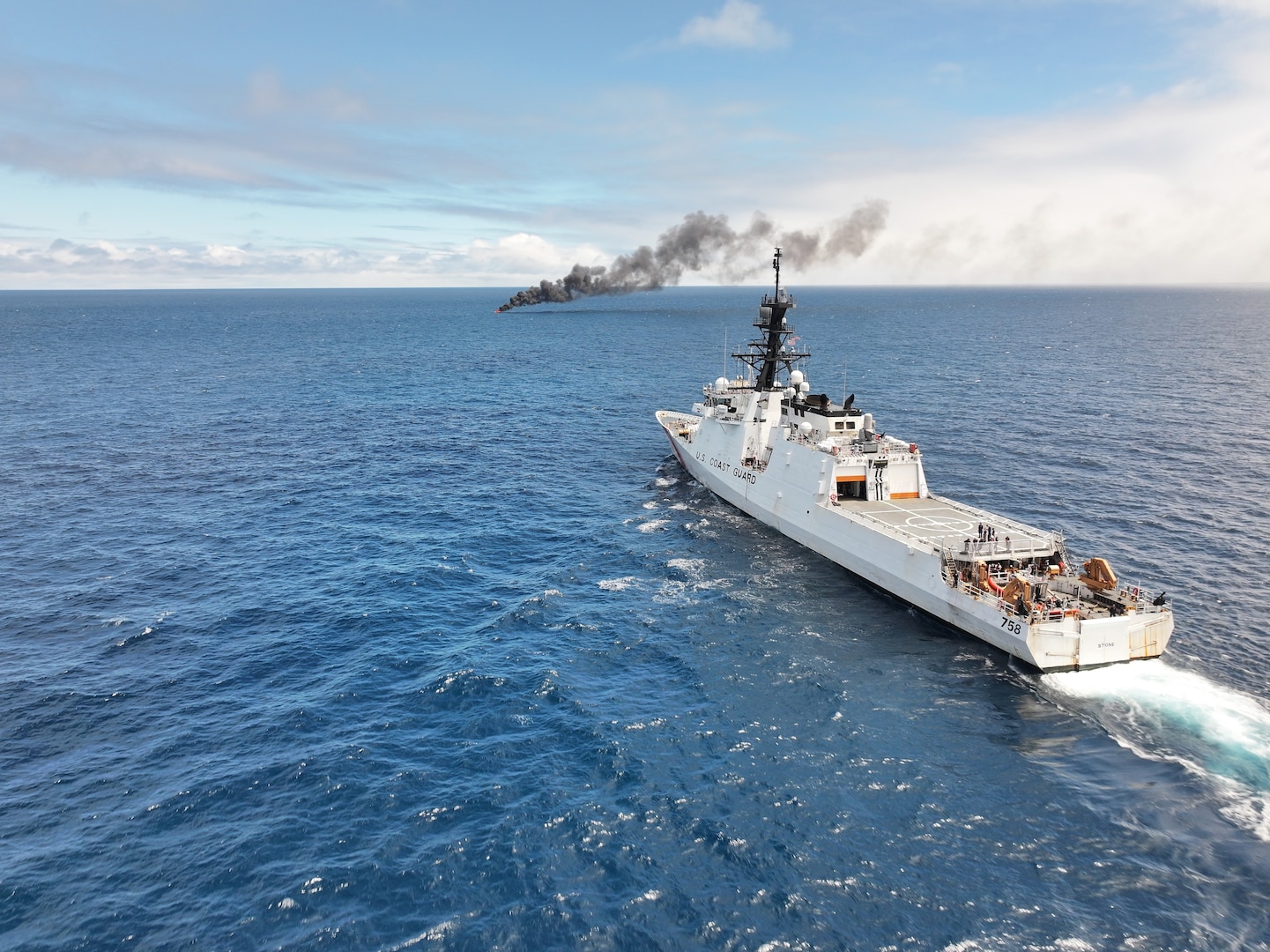 The crew of USCGC Stone (WMSL 758) keeps watch over a burning vessel that was interdicted in the Eastern Pacific Ocean, Aug. 16, 2025. Through Operation Pacific Viper, the Coast Guard is accelerating counter-drug operations in the Eastern Pacific Ocean, where significant transport of illicit narcotics continues from South America. (U.S. Coast Guard photo)