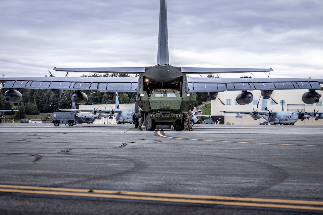 A MC-130J Commando II assigned to the 27th Special Operations Wing, transports Marines with 2nd Battalion, 14th Marine regiment, 4th Marine Division, to Kotzebue, Alaska, for High Mobility Artillery Rocket System (HIMARS) training during ARCTIC EDGE 2025 (AE25) at Joint Base Elmendorf-Richardson, Alaska, Aug. 19th, 2025. Specialized Arctic training generates valuable lessons learned for warfighters and enablers ensuring they can execute their assigned missions in any environment. AE25 is a NORAD and U.S. Northern Command-led homeland defense exercise designed to improve readiness, demonstrate capabilities and enhance Joint and Allied Force interoperability in the Arctic. (U.S. Marine Corps Photo by Lance Cpl. Edward Spears)