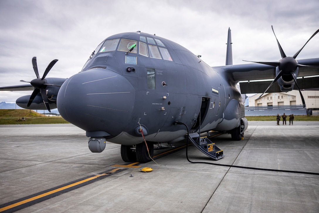 A MC-130J Commando II assigned to the 27th Special Operations Wing, prepares to transports U.S. Marines with 2nd Battalion, 14th Marine regiment, 4th Marine Division, to High Mobility Artillery Rocket System (HIMARS) training during ARCTIC EDGE 2025 (AE25) at Joint Base Elmendorf-Richardson, Alaska, Aug. 19th, 2025. Specialized Arctic training generates valuable lessons learned for warfighters and enablers ensuring they can execute their assigned missions in any environment. AE25 is a NORAD and U.S. Northern Command-led homeland defense exercise designed to improve readiness, demonstrate capabilities and enhance Joint and Allied Force interoperability in the Arctic. (U.S. Marine Corps Photo by Lance Cpl. Edward Spears. This photo has been altered for security purpose.)