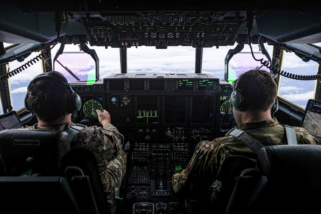 U.S. Airmen assigned to the 27th Special Operations Wing, pilot a MC-130J Commando II ARCTIC EDGE 2025 (AE25) at Joint Base Elmendorf-Richardson, Alaska, Aug. 19th, 2025. Specialized Arctic training generates valuable lessons learned for warfighters and enablers ensuring they can execute their assigned missions in any environment. AE25 is a NORAD and U.S. Northern Command-led homeland defense exercise designed to improve readiness, demonstrate capabilities and enhance Joint and Allied Force interoperability in the Arctic. (U.S. Marine Corps Photo by Lance Cpl. Edward Spears. This photo has been altered for security purpose.)