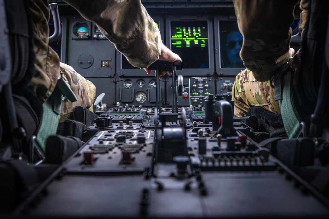 U.S. Airmen assigned to the 27th Special Operations Wing, pilot a MC-130J Commando II transporting U.S. Marines and equipment for High Mobility Artillery Rocket System (HIMARS) training during ARCTIC EDGE 2025 (AE25) at Joint Base Elmendorf-Richardson, Alaska, Aug. 19th, 2025. Specialized Arctic training generates valuable lessons learned for warfighters and enablers ensuring they can execute their assigned missions in any environment. AE25 is a NORAD and U.S. Northern Command-led homeland defense exercise designed to improve readiness, demonstrate capabilities and enhance Joint and Allied Force interoperability in the Arctic. (U.S. Marine Corps Photo by Lance Cpl. Edward Spears)