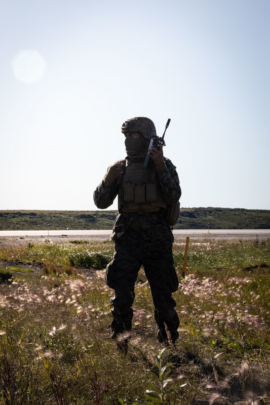 U.S. Marine Corps Cpl. Juan Barragan, communication specialist, with 7th Marine Regiment, 1st Marine Division, begins radio communication during High Mobility Artillery Rocket System (HIMARS) training at ARCTIC EDGE 2025 (AE25) at Kotzebue, Alaska, Aug. 19th, 2025. Specialized Arctic training generates valuable lessons learned for warfighters and enablers ensuring they can execute their assigned missions in any environment. AE25 is a NORAD and U.S. Northern Command-led homeland defense exercise designed to improve readiness, demonstrate capabilities and enhance Joint and Allied Force interoperability in the Arctic. (U.S. Marine Corps Photo by Lance Cpl. Edward Spears)
