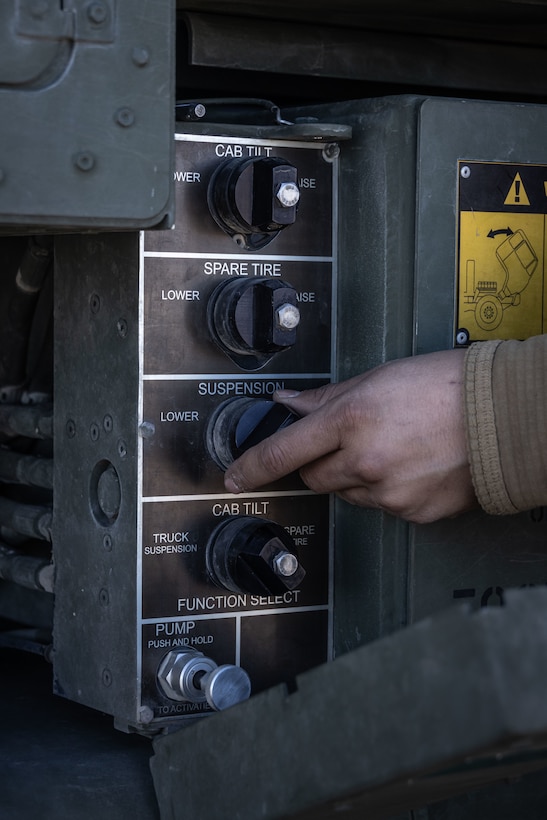 A U.S. Marine with 2nd Battalion, 14th Marine regiment, 4th Marine Division, lowers suspension on a High Mobility Artillery Rocket System (HIMARS) during training at ARCTIC EDGE 2025 (AE25) at Kotzebue, Alaska, Aug. 19th, 2025. Specialized Arctic training generates valuable lessons learned for warfighters and enablers ensuring they can execute their assigned missions in any environment. AE25 is a NORAD and U.S. Northern Command-led homeland defense exercise designed to improve readiness, demonstrate capabilities and enhance Joint and Allied Force interoperability in the Arctic. (U.S. Marine Corps Photo by Lance Cpl. Edward Spears)