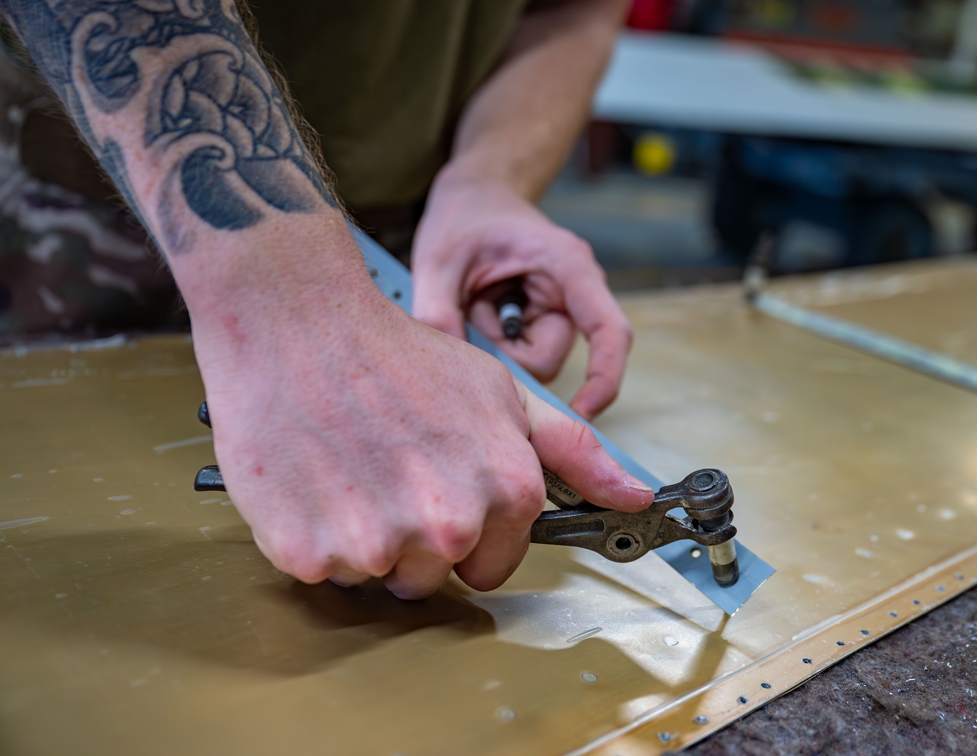 920th Maintenance Squadron aircraft structural maintenance technician, prepares to install a new skin panel on the right-hand aileron of an HC-130J Combat King II aircraft.