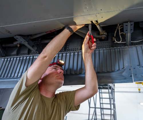 920th Maintenance Squadron crew chief, repairs the right-wing aileron of an HC-130J Combat King II aircraft