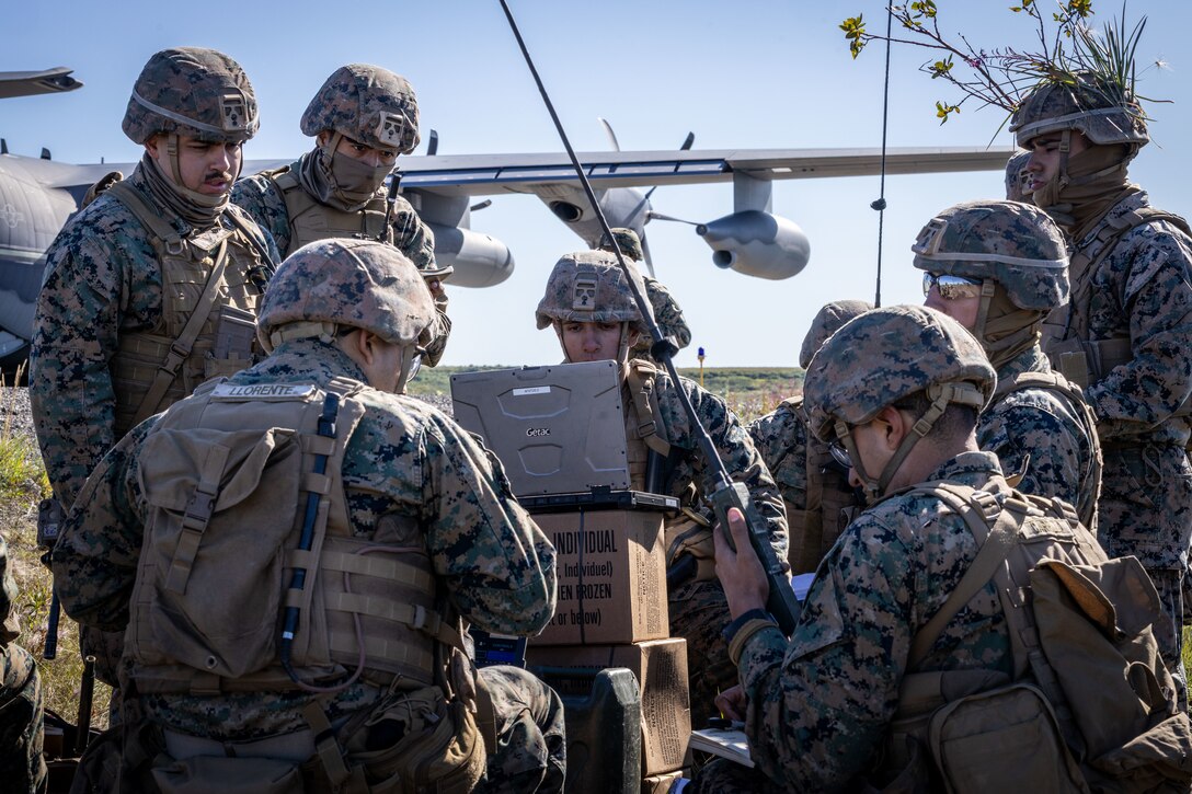 U.S. Marines with 2nd Battalion, 14th Marine regiment, 4th Marine Division, relay target coordinates during High Mobility Artillery Rocket System (HIMARS) as part of ARCTIC EDGE 2025 (AE25) at Kotzebue, Alaska, Aug. 19th, 2025. Specialized Arctic training generates valuable lessons learned for warfighters and enablers ensuring they can execute their assigned missions in any environment. AE25 is a NORAD and U.S. Northern Command-led homeland defense exercise designed to improve readiness, demonstrate capabilities and enhance Joint and Allied Force interoperability in the Arctic. (U.S. Marine Corps Photo by Lance Cpl. Edward Spears)