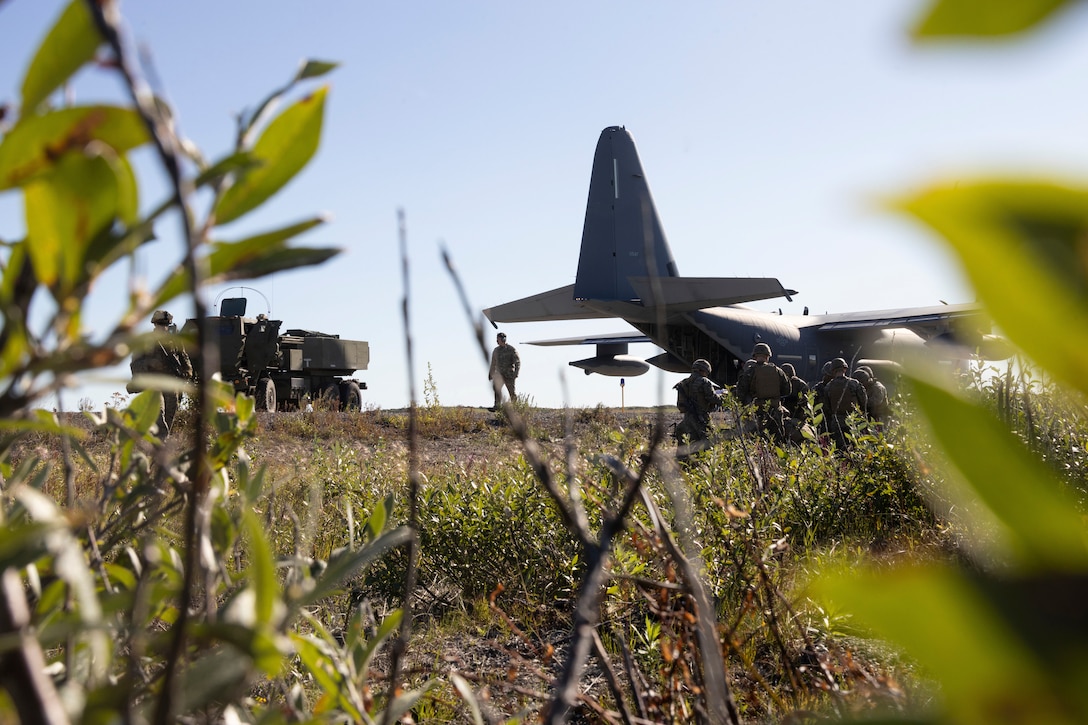 U.S. Marines with 2nd Battalion, 14th Marine regiment, 4th Marine Division, set up a command center during High Mobility Artillery Rocket System (HIMARS) training as part of ARCTIC EDGE 2025 (AE25) at Kotzebue, Alaska, Aug. 19th, 2025. Specialized Arctic training generates valuable lessons learned for warfighters and enablers ensuring they can execute their assigned missions in any environment. AE25 is a NORAD and U.S. Northern Command-led homeland defense exercise designed to improve readiness, demonstrate capabilities and enhance Joint and Allied Force interoperability in the Arctic. (U.S. Marine Corps Photo by Lance Cpl. Edward Spears. This photo has been altered for security purpose.)