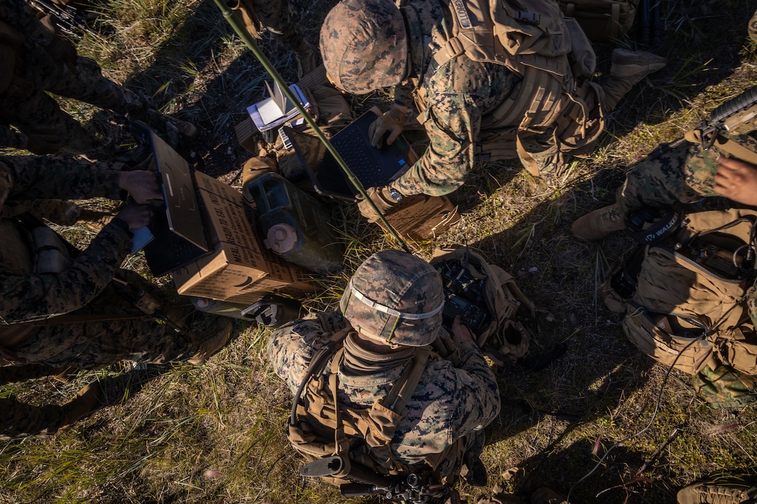 U.S. Marines with 2nd Battalion, 14th Marine regiment, 4th Marine Division, set up a command center during High Mobility Artillery Rocket System (HIMARS) training as part of ARCTIC EDGE 2025 (AE25) at Kotzebue, Alaska, Aug. 19th, 2025. Specialized Arctic training generates valuable lessons learned for warfighters and enablers ensuring they can execute their assigned missions in any environment. AE25 is a NORAD and U.S. Northern Command-led homeland defense exercise designed to improve readiness, demonstrate capabilities and enhance Joint and Allied Force interoperability in the Arctic. (U.S. Marine Corps Photo by Lance Cpl. Edward Spears)