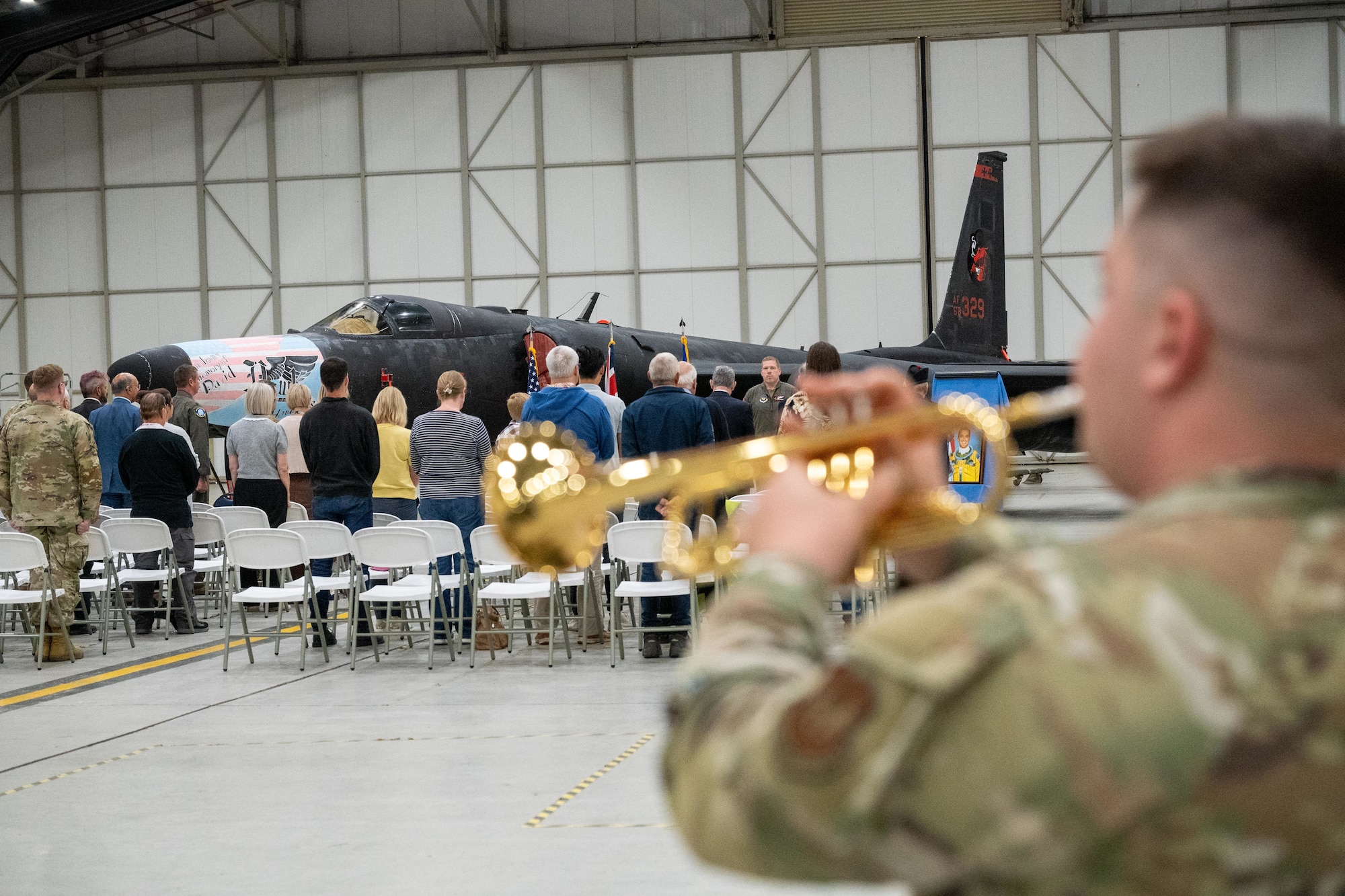 An Airman plays taps during the 30th anniversary memorial service for Capt. David “Hawk” Hawkens