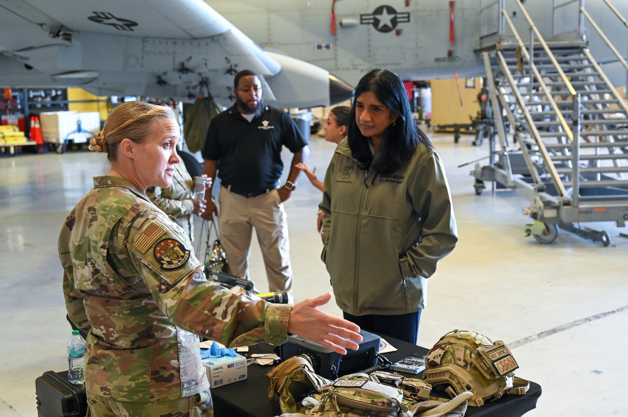 Maryland Lt. Gov. Aruna Miller speaks with Maryland Air National Guard Senior Master Sgt. Jennifer Blood, 175th Wing installation emergency manager, at a unit display table during the 2025 Boss Lift event at Warfield Air National Guard Base at Martin State Airport, Maryland, August 22, 2025. Employers got a firsthand look at the duties and skills of their employees who serve in the Maryland National Guard during the Employer Support of the Guard and Reserve Boss Lift event. (U.S. Air National Guard Photo by Senior Master Sgt. Christopher Schepers)
