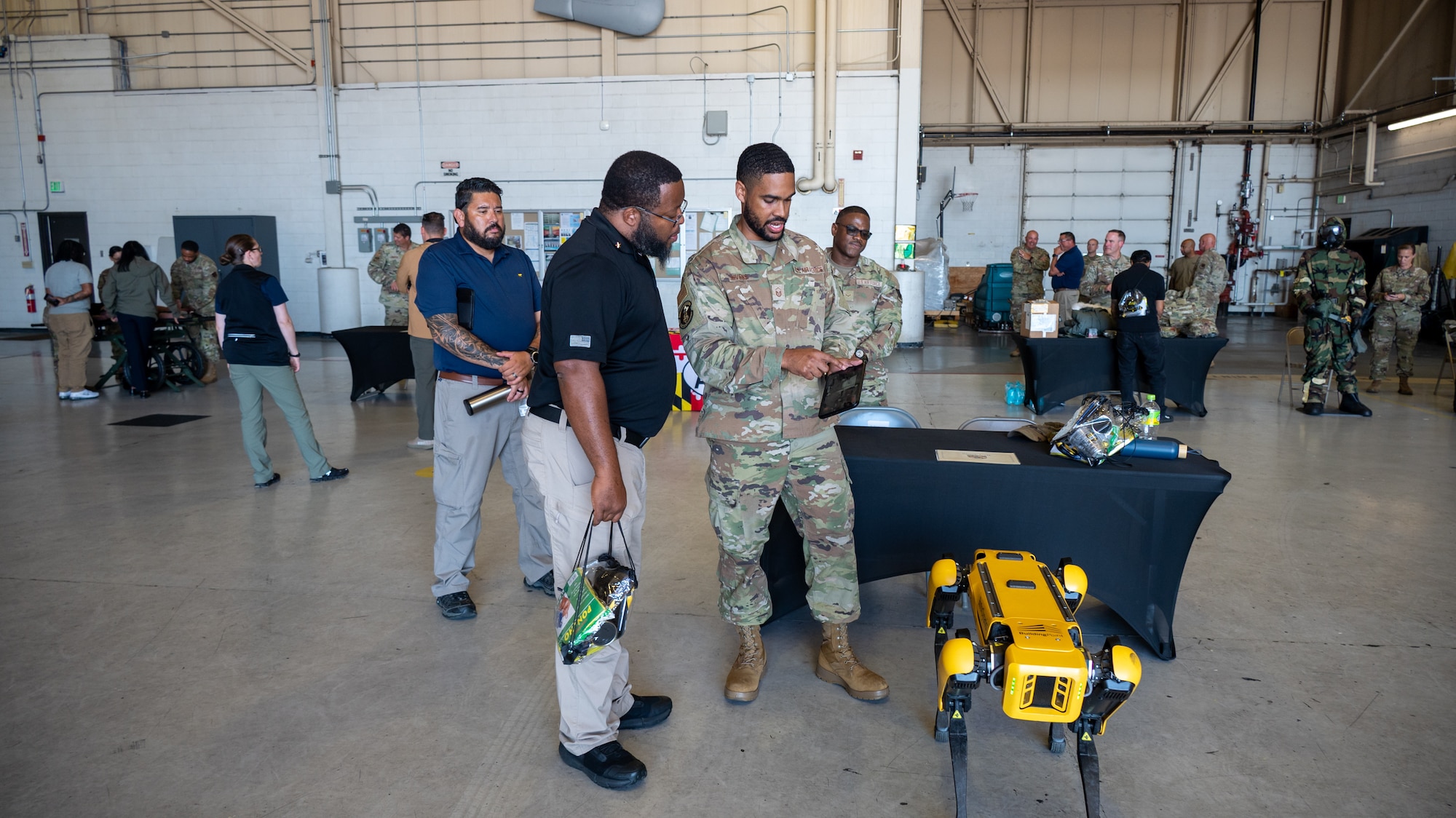 Civilian employers of the Maryland National Guard meet with Airmen and Soldiers to learn about the missions and technology of the various support units of the Maryland National Guard during the 2025 Boss Lift event at Warfield Air National Guard Base at Martin State Airport, Maryland, August 22, 2025. Employers got a firsthand look at the duties and skills of their employees who serve in the Maryland National Guard during the Employer Support of the Guard and Reserve Boss Lift event.  (U.S. Air National Guard Photo by Airman 1st Class Sarah Hoover)