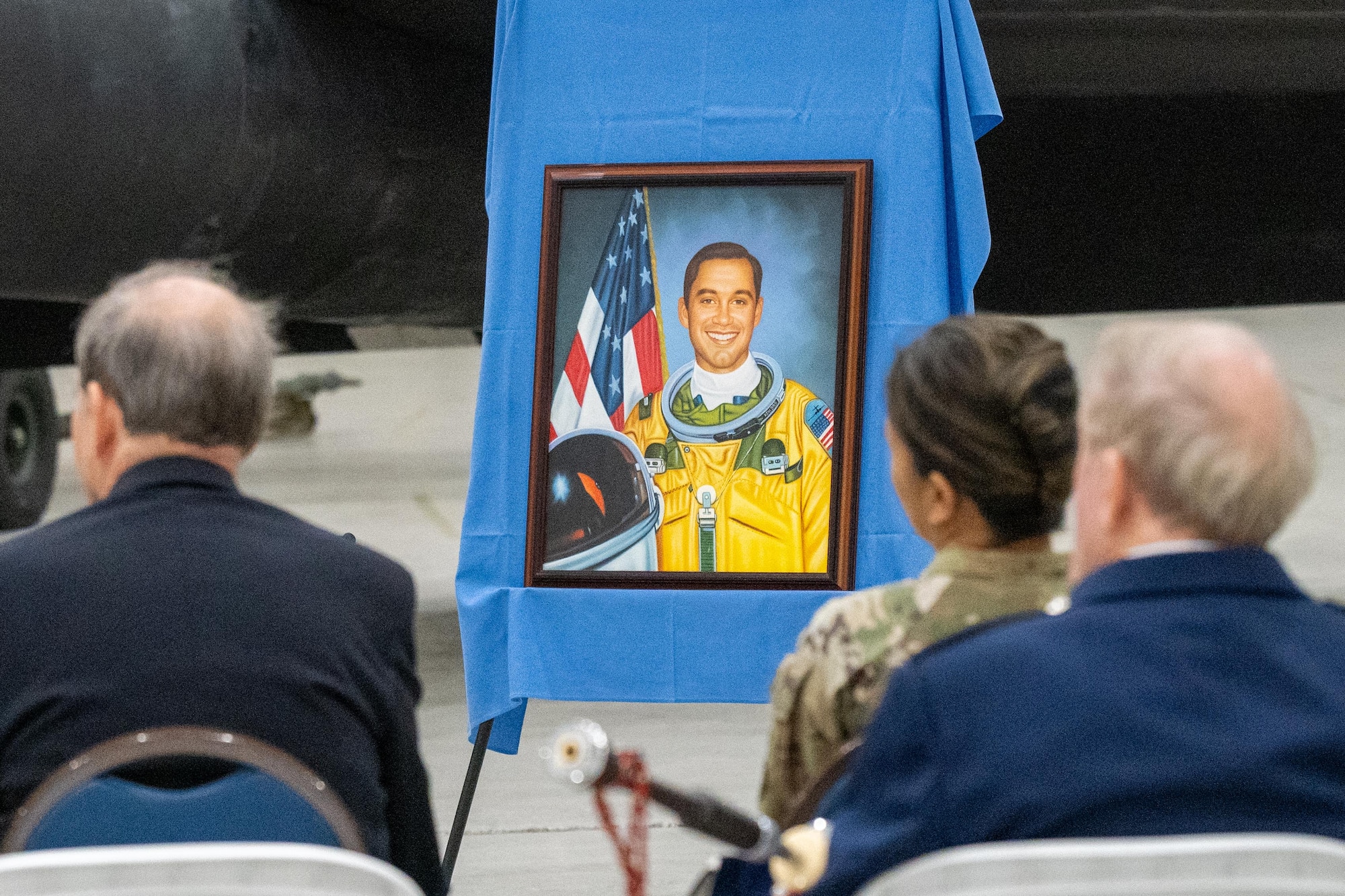 A portrait of Capt. David “Hawk” Hawkens is displayed during a memorial service