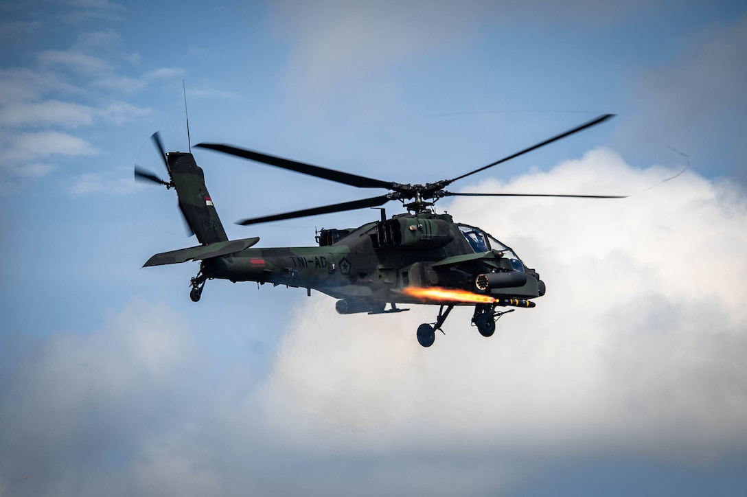 A U.S. Army AH-64E Apache Guardian helicopter assigned to the 4th Squadron, 6th Cavalry Regiment, 16th Combat Aviation Brigade, Joint Base Lewis-McChord, Washington, engages a simulated target at the joint land strike exercise with the Indonesian National Armed Forces and Australian Defence Forces during Super Garuda Shield 25 in Baturaja, Indonesia, Sept. 1, 2025.