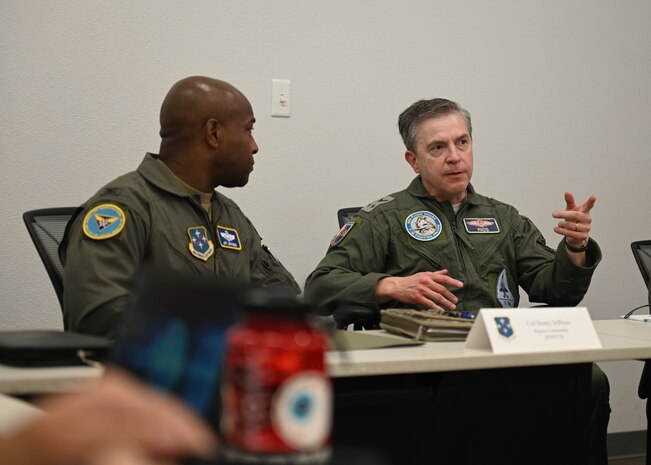 U.S. Air Force Col. Henry Jeffress, Air Forces Southern deputy commander, left, and Chilean (FACh) Air Force Maj. Gen. Alfredo Ríos, FACh director of operations, right, engage during their annual Airman-to-Airman Talks at Davis-Monthan Air Force Base, Arizona, Aug. 27, 2025. The A2A Talks was an annual event to discuss upcoming events and establish security cooperation activities for next calendar year, 2026 to 2027. (U.S. Air Force photo by Staff Sgt. Abbey Rieves)