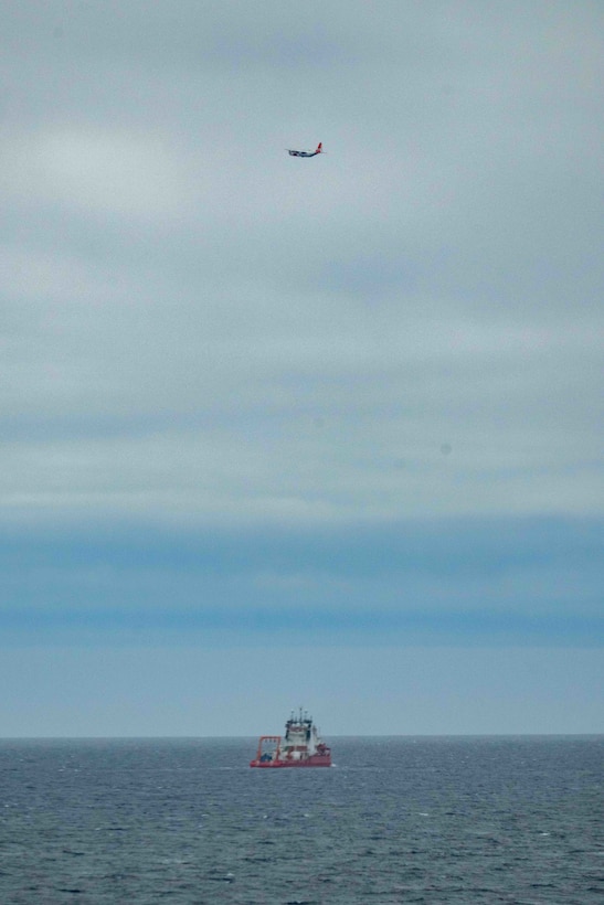 An HC-130J Hercules fixed wing aircraft from Air Station Kodiak flies over the Liberia-flagged Chinese research ship, Zhong Shan Da Xue Ji Di, over the delineated U.S. Extended Continental Shelf, approximately 230 miles north of Utqiagvik, Alaska, Aug. 31, 2025. The Coast Guard is the only U.S. surface presence in the Arctic and works in conjunction with U.S. Northern Command and Alaskan Command to constantly monitor foreign vessels operating in and near U.S. waters in support of U.S. homeland defense and security operations. (U.S. Coast Guard photo)