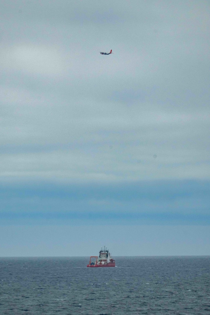 An HC-130J Hercules fixed wing aircraft from Air Station Kodiak flies over the Liberia-flagged Chinese research ship, Zhong Shan Da Xue Ji Di, over the delineated U.S. Extended Continental Shelf, approximately 230 miles north of Utqiagvik, Alaska, Aug. 31, 2025. The Coast Guard is the only U.S. surface presence in the Arctic and works in conjunction with U.S. Northern Command and Alaskan Command to constantly monitor foreign vessels operating in and near U.S. waters in support of U.S. homeland defense and security operations. (U.S. Coast Guard photo)