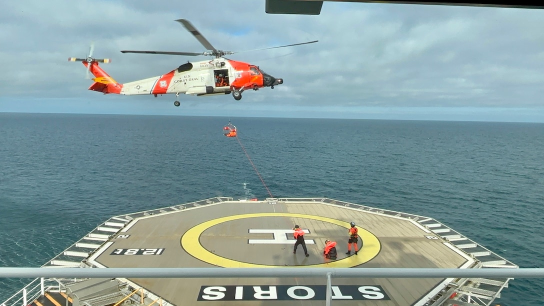 Crewmembers from the Coast Guard Cutter Storis (WAGB 21) conduct helicopter operations with an MH60-Jayhawk helicopter air crew from Coast Guard Air Station Kodiak, Alaska, while underway in the Gulf of Alaska, Aug. 20, 2025. The Coast Guard is the only U.S. surface presence in the Arctic and works in conjunction with U.S. Northern Command and Alaskan Command to constantly monitor foreign vessels operating in and near U.S. waters in support of U.S. homeland defense and security operations. (U.S. Coast Guard photo)