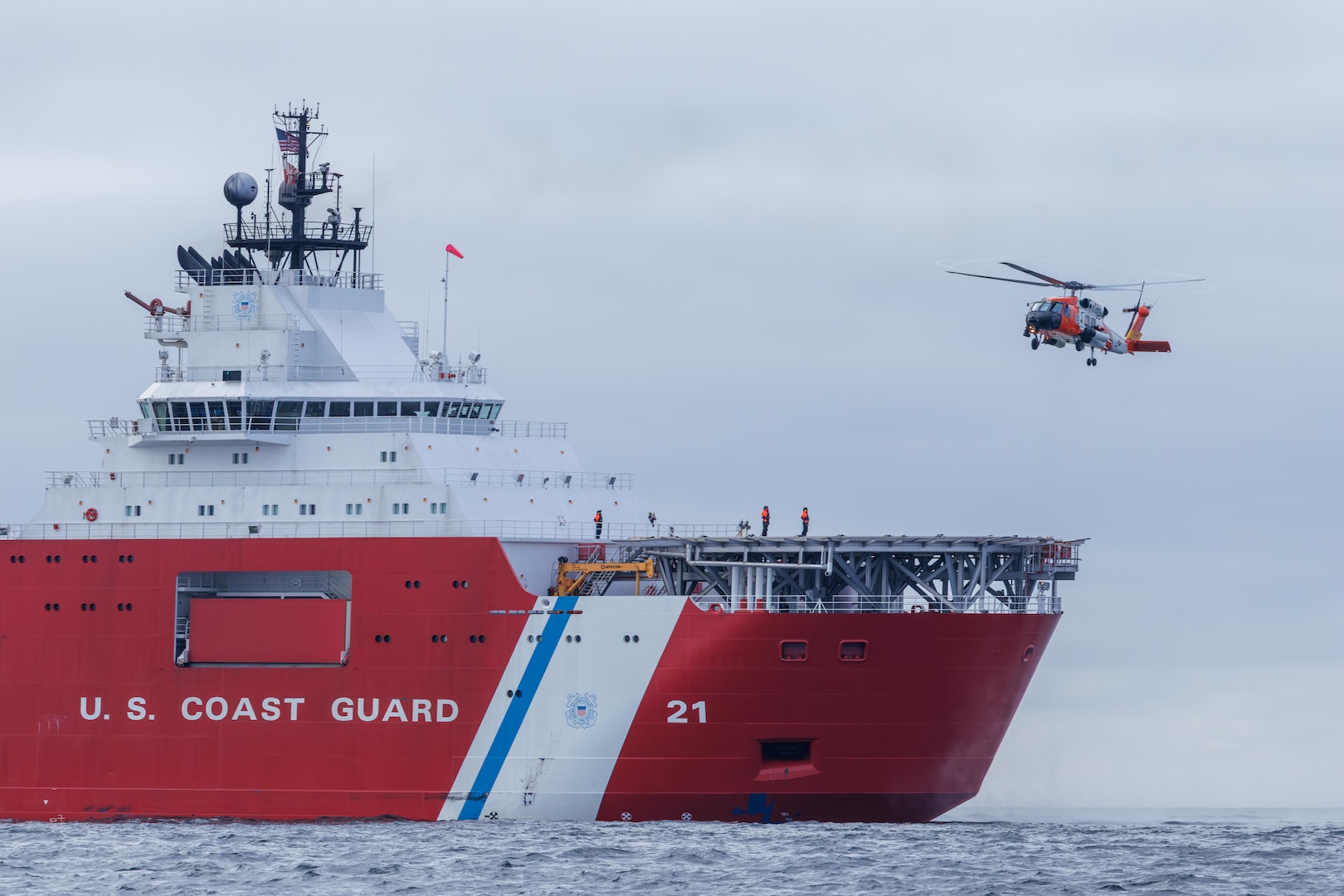 Crewmembers from the Coast Guard Cutter Storis (WAGB 21) conduct helicopter operations with an MH60-Jayhawk helicopter air crew from Coast Guard Air Station Kodiak, Alaska, while underway in the Gulf of Alaska, Aug. 20, 2025. The Coast Guard is the only U.S. surface presence in the Arctic and works in conjunction with U.S. Northern Command and Alaskan Command to constantly monitor foreign vessels operating in and near U.S. waters in support of U.S. homeland defense and security operations. (U.S. Coast Guard photo)