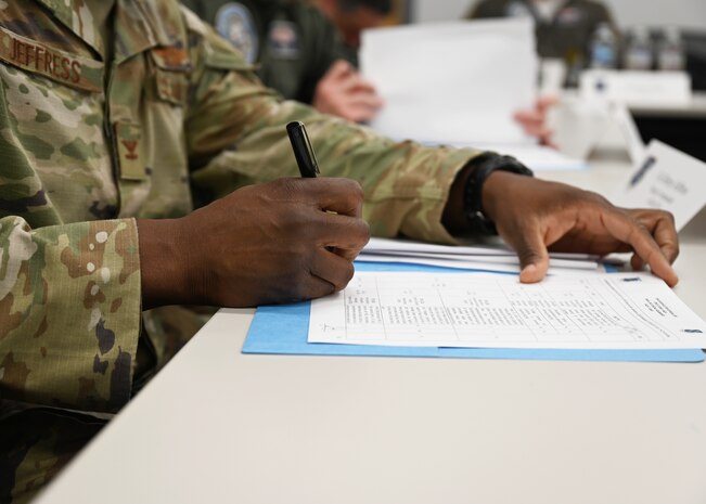 U.S. Air Force Col. Henry Jeffress, Air Forces Southern deputy commander, signs an agreement during the annual Airman-to-Airman Talks at Davis-Monthan Air Force Base, Arizona, Aug. 28, 2025. The A2A talks allowed the U.S. Air Force and Chilean (FACh) Air Force to discuss future cooperation goals and priorities between the two countries. (U.S. Air Force photo by Staff Sgt. Abbey Rieves)