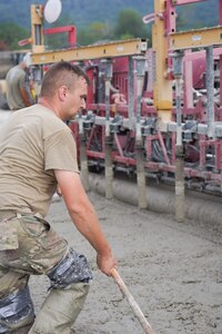 Airmen assigned to the 139th Civil Engineer Squadron, Missouri Air National Guard, construct a mock runway at Fort Indiantown Gap, Pennsylvania, Aug. 18, 2025. The site will be used for Rapid Airfield Damage Recovery training by civil engineers across the Air National Guard. (U.S. Air National Guard photo by Staff Sgt. Keenan Aitchison)