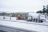 Airmen assigned to the 139th Civil Engineer Squadron, Missouri Air National Guard, construct a mock runway at Fort Indiantown Gap, Pennsylvania, Aug. 18, 2025. The site will be used for Rapid Airfield Damage Recovery training by civil engineers across the Air National Guard. (U.S. Air National Guard photo by Staff Sgt. Keenan Aitchison)