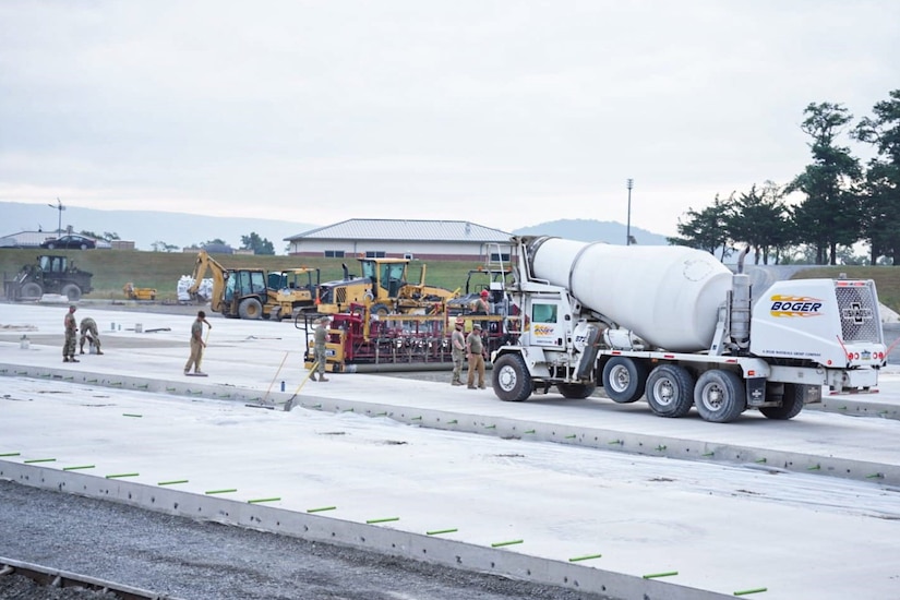 Airmen assigned to the 139th Civil Engineer Squadron, Missouri Air National Guard, construct a mock runway at Fort Indiantown Gap, Pennsylvania, Aug. 18, 2025. The site will be used for Rapid Airfield Damage Recovery training by civil engineers across the Air National Guard. (U.S. Air National Guard photo by Staff Sgt. Keenan Aitchison)