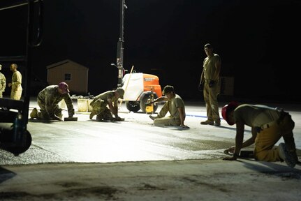 Airmen assigned to the 139th Civil Engineer Squadron, Missouri Air National Guard, construct a mock runway at Fort Indiantown Gap, Pennsylvania, Aug. 18, 2025. The site will be used for Rapid Airfield Damage Recovery training by civil engineers across the Air National Guard. (U.S. Air National Guard photo by Staff Sgt. Keenan Aitchison)