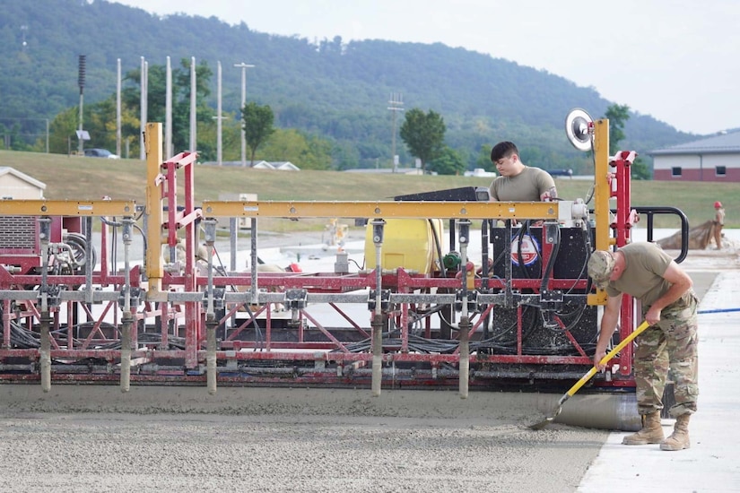Airmen assigned to the 139th Civil Engineer Squadron, Missouri Air National Guard, construct a mock runway at Fort Indiantown Gap, Pennsylvania, Aug. 18, 2025. The site will be used for Rapid Airfield Damage Recovery training by civil engineers across the Air National Guard. (U.S. Air National Guard photo by Staff Sgt. Keenan Aitchison)