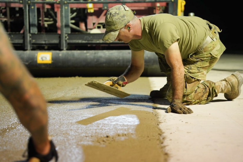 Airmen assigned to the 139th Civil Engineer Squadron, Missouri Air National Guard, construct a mock runway at Fort Indiantown Gap, Pennsylvania, Aug. 18, 2025. The site will be used for Rapid Airfield Damage Recovery training by civil engineers across the Air National Guard. (U.S. Air National Guard photo by Staff Sgt. Keenan Aitchison)