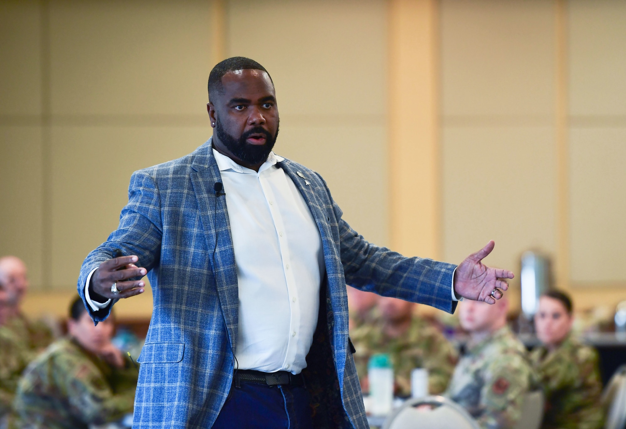A man speaks to a group of people.