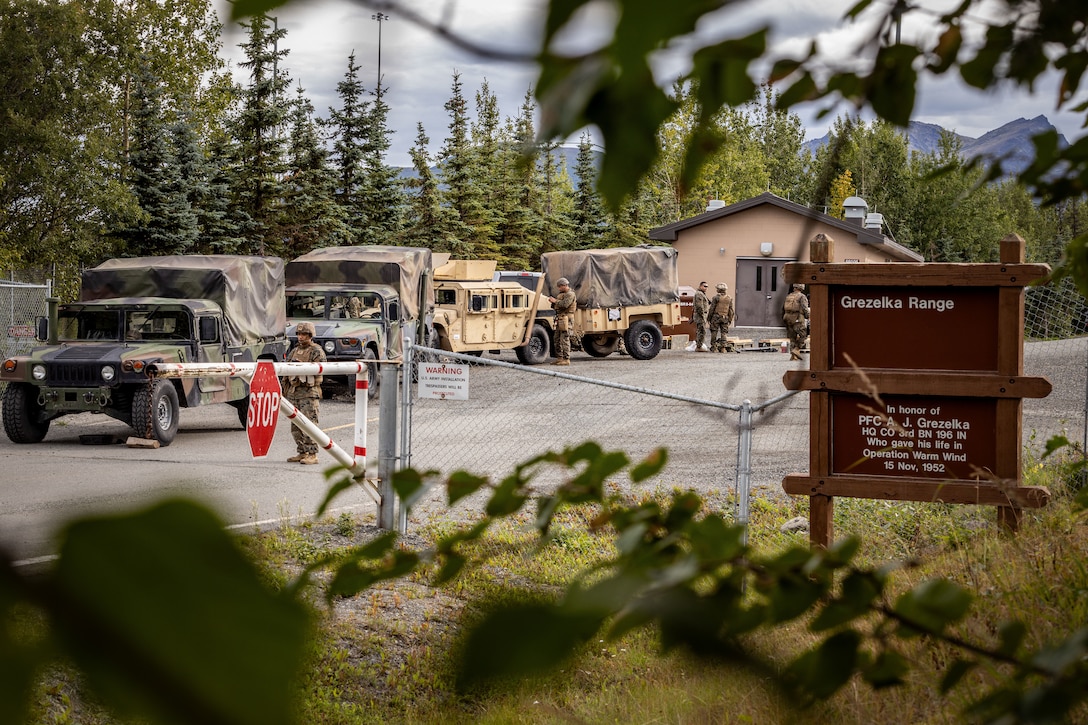 U.S. Marines with 2nd Battalion, 14th Marine regiment, 4th Marine Division and 3rd Battalion, 4th Marine Regiment, 1st Marine Division, arrive at the Range Grezelka during ARTIC EDGE 2025 (AE25), at Joint Base Elmendorf-Richardson, Alaska, Aug. 16th, 2025. Specialized Arctic training generates valuable lessons learned for warfighters and enablers ensuring they can execute their assigned missions in any environment. AE25 is a NORAD and U.S. Northern Command-led homeland defense exercise designed to improve readiness, demonstrate capabilities and enhance Joint and Allied Force interoperability in the Arctic. (U.S. Marine Corps Photo by Lance Cpl. Edward Spears)