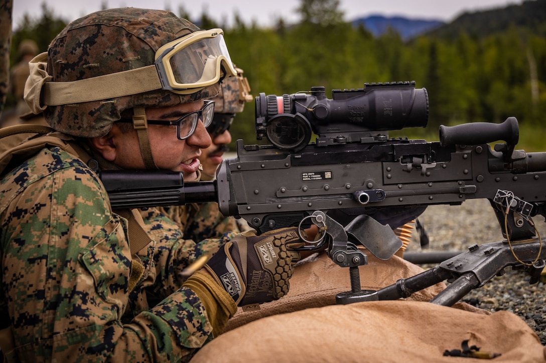 U.S. Marine Corps Lance Cpl. Fernando Carrillo, a radio operator, with 2nd Battalion, 14th Marine regiment, 4th Marine Division, fires a M240 during range familiarization training as part of ARCTIC EDGE 2025 (AE25), at Joint Base Elmendorf-Richardson, Alaska, Aug. 16th, 2025. Specialized Arctic training generates valuable lessons learned for warfighters and enablers ensuring they can execute their assigned missions in any environment. AE25 is a NORAD and U.S. Northern Command-led homeland defense exercise designed to improve readiness, demonstrate capabilities and enhance Joint and Allied Force interoperability in the Arctic. (U.S. Marine Corps Photo by Lance Cpl. Edward Spears)