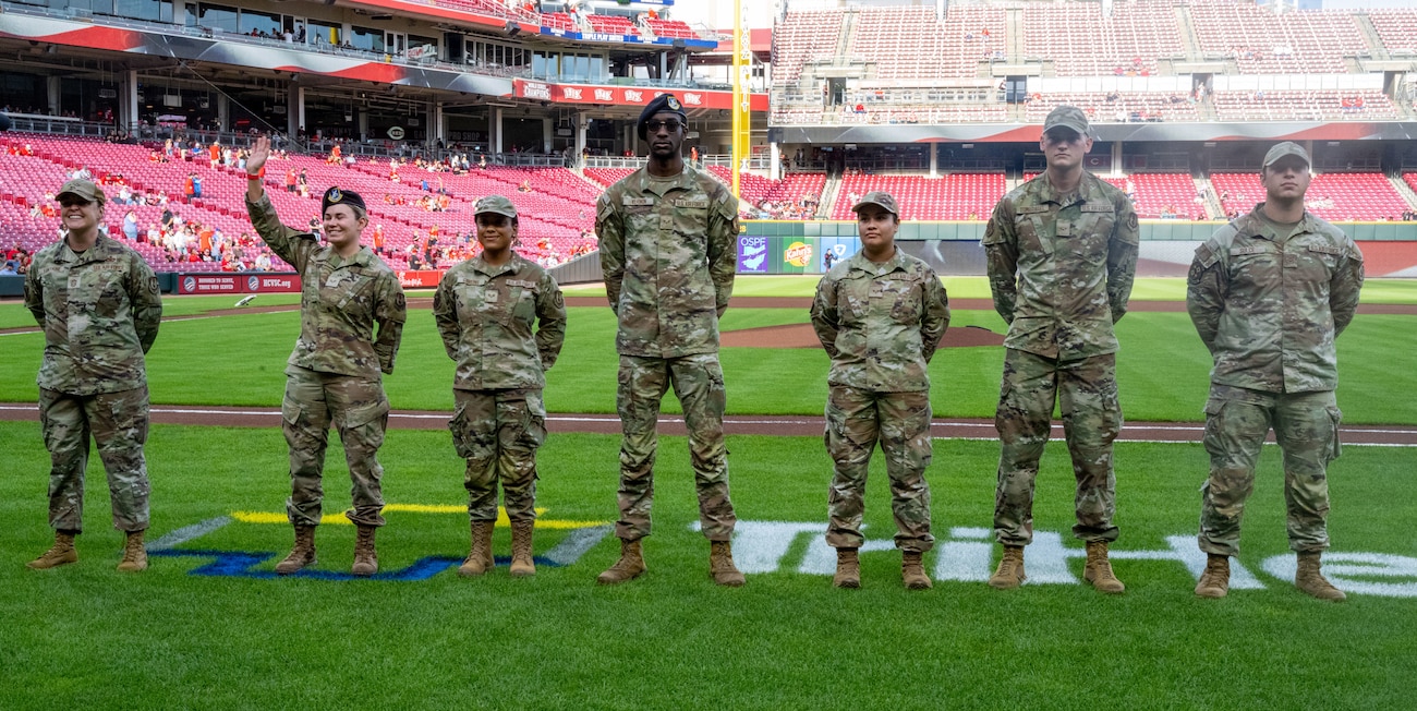 High performers from Wright-Patterson Air Force Base take the field pre-game to receive recognition for their accomplishments at Great American Ball Park, Aug. 29, 2025. The event was part of the Reds’ annual Military Appreciation Night. (U.S. Air Force photo by Jack Gardner)