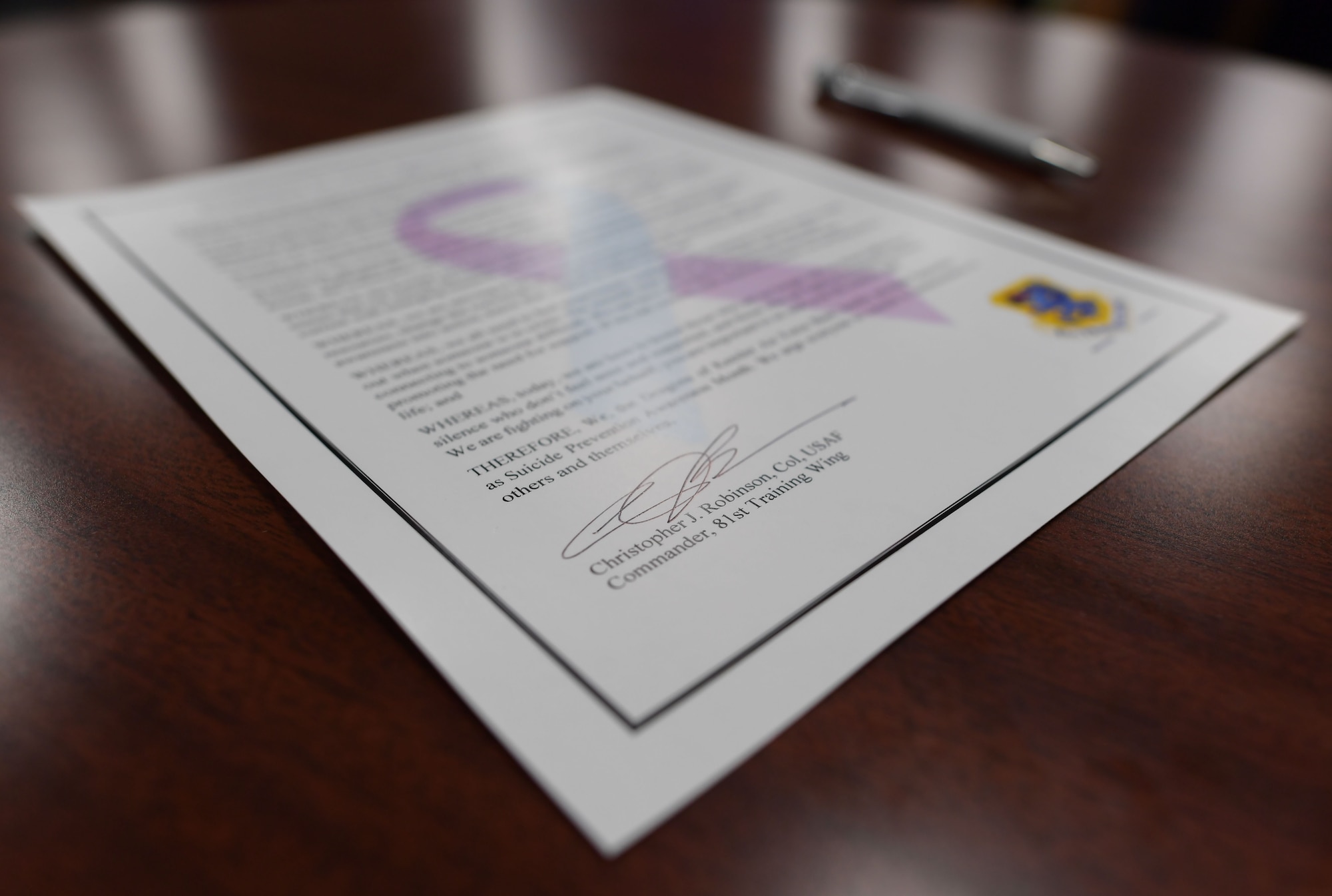 A proclamation is on display on a table.