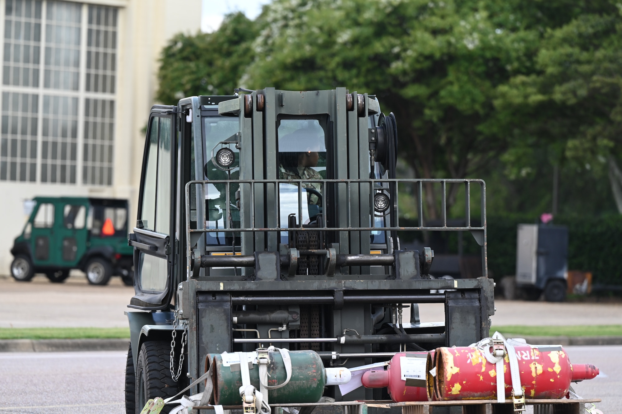a person drives a forklift