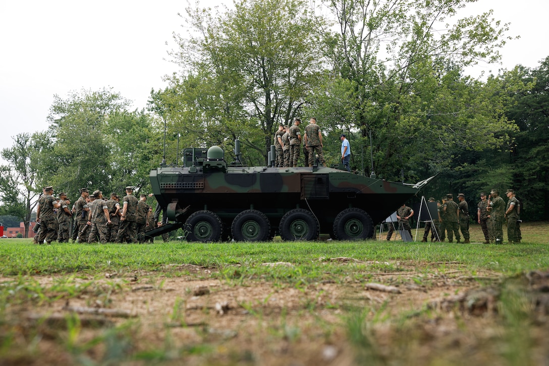 U.S. Marines with 3rd Platoon, Company C, Basic Officer Course 3-25, The Basic School participate in Amphibious Combat Vehicle integration training at TBS on Marine Corps Base Quantico, Virginia, Aug. 18, 2025. Students had the opportunity to speak with subject matter experts and observe the Amphibious Combat Vehicle—Command variant to learn more about the capabilities and limitations of the ACV-C and the rest of the family of vehicles, and how they will be implemented/operated within the Fleet Marine Force. (U.S. Marine Corps photo by Cpl. Joshua Barker)