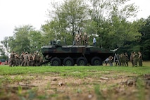 U.S. Marines with 3rd Platoon, Company C, Basic Officer Course 3-25, The Basic School participate in Amphibious Combat Vehicle integration training at TBS on Marine Corps Base Quantico, Virginia, Aug. 18, 2025. Students had the opportunity to speak with subject matter experts and observe the Amphibious Combat Vehicle—Command variant to learn more about the capabilities and limitations of the ACV-C and the rest of the family of vehicles, and how they will be implemented/operated within the Fleet Marine Force. (U.S. Marine Corps photo by Cpl. Joshua Barker)