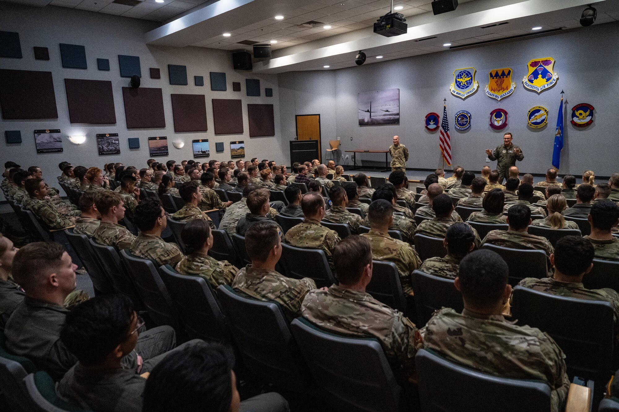 U.S. Air Force Gen. Johnny Lamontagne, Air Mobility Command commander, and Chief Master Sgt. Jamie Newman, AMC command chief, address Airmen assigned to the 317th Airlift Wing at Dyess Air Force Base, Texas, Aug. 26, 2025. Lamontagne emphasized AMC’s commitment to developing Mission Ready Airmen, enhancing operational capabilities, and strengthening relationships across the mobility enterprise. (U.S. Air Force photo by Senior Airman Jade M. Caldwell)