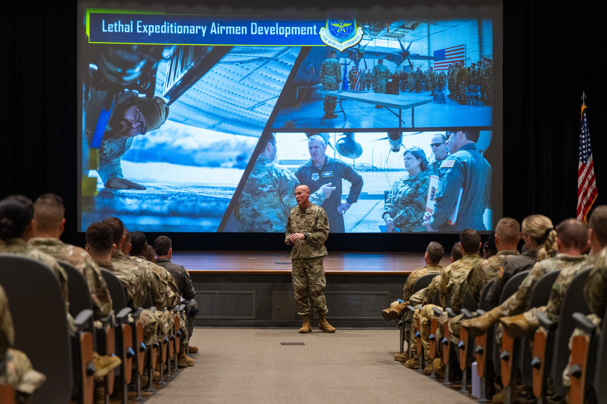 U.S. Air Force Chief Master Sgt. Jamie Newman, Air Mobility Command command chief, gives remarks during a commander’s call at Dyess Air Force Base, Texas, Aug. 27, 2025. During the all-call, the AMC command team emphasized initiatives focused on developing Mission-Ready Airmen, enhancing operational capabilities, and strengthening relationships across the mobility community. (U.S. Air Force photo by Senior Airman Jade M. Caldwell)