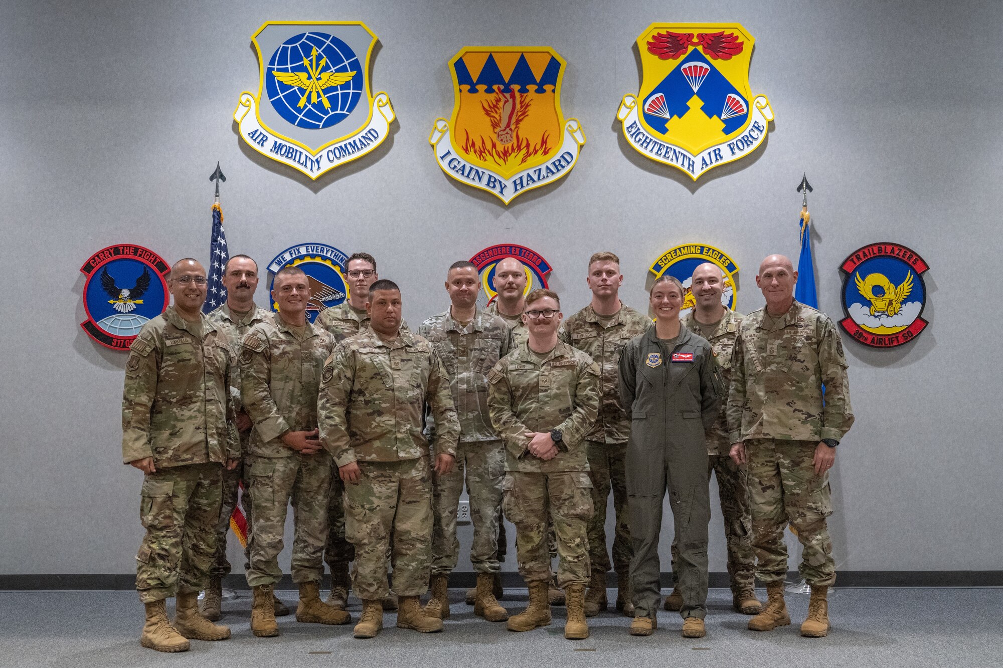 U.S. Air Force Chief Master Sgt. Jamie Newman, Air Mobility Command command chief, poses for a group photo with Airmen from the 317th Airlift Wing at Dyess Air Force Base, Texas, Aug. 27, 2025. The visit provided AMC leadership with direct insight into how the 317th AW supports the command’s global rapid mobility mission. (U.S. Air Force Photo by Airman 1st Class Caleb Schellenberg)