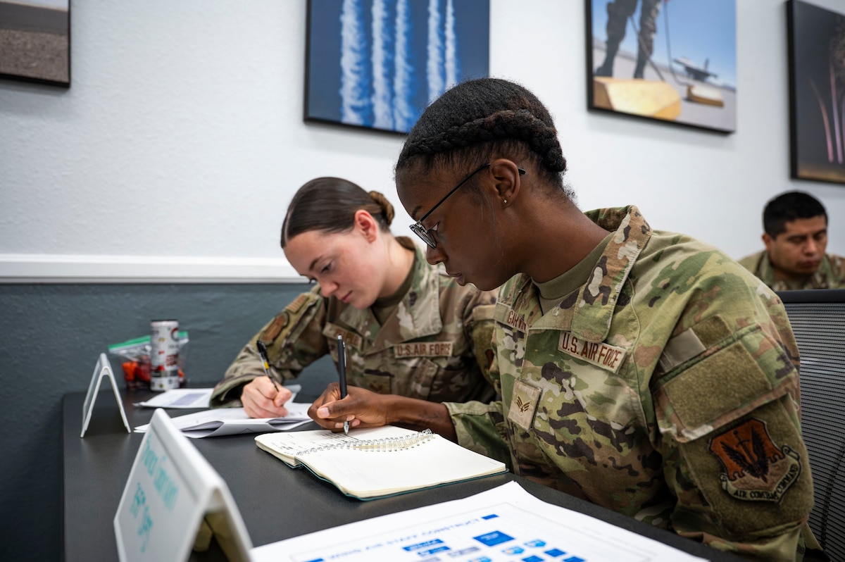 U.S. Air Force Senior Airman Shanea Garvin, 355th Security Forces Squadron response team member, takes notes during the Junior Enlisted Foundations 300 Course at Davis-Monthan Air Force Base, Arizona, Sept. 3, 2025. The training provides Airmen with a strong foundation to support mission readiness and professional growth. (U.S. Air Force photo by Airman 1st Class Samantha Melecio)